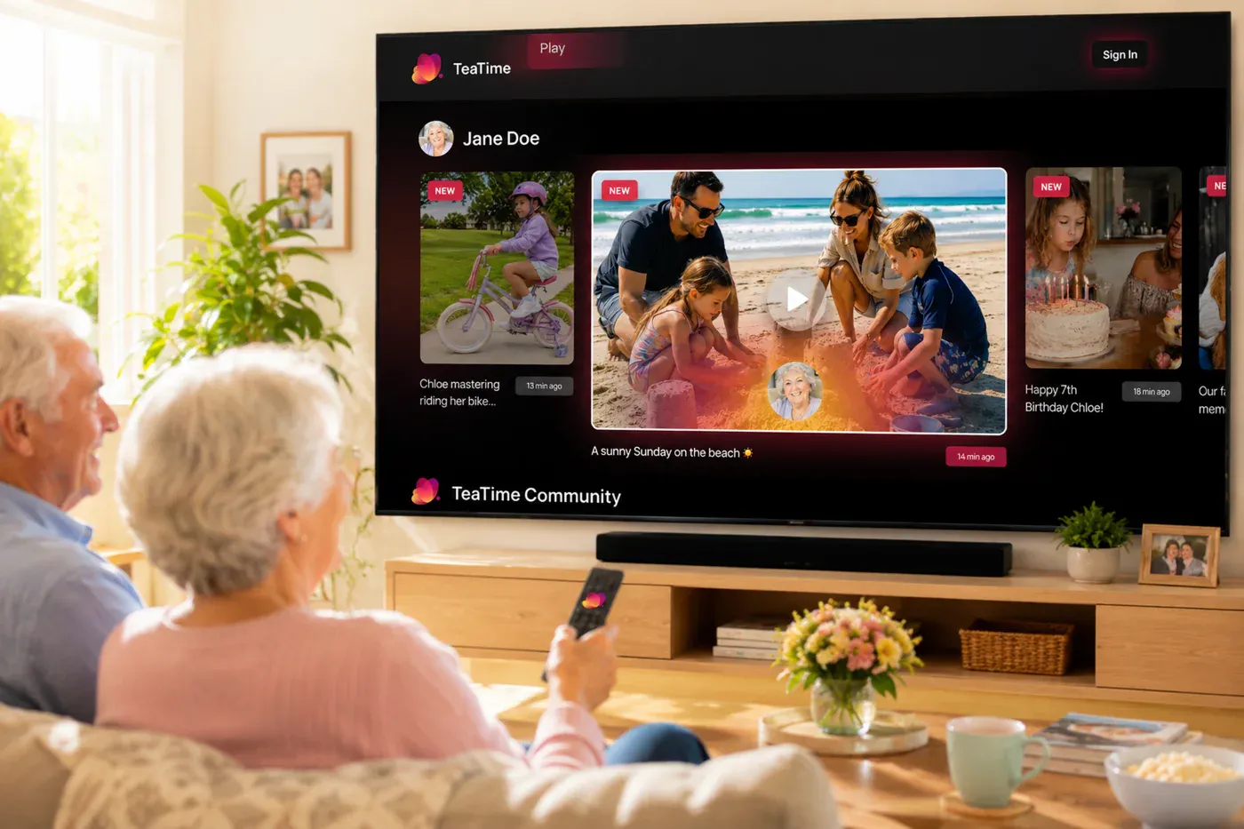 An older couple viewing family memories through TeaTime on a television